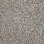 Close-up of beige textured carpet fibers at a macro scale, showing dense pile.