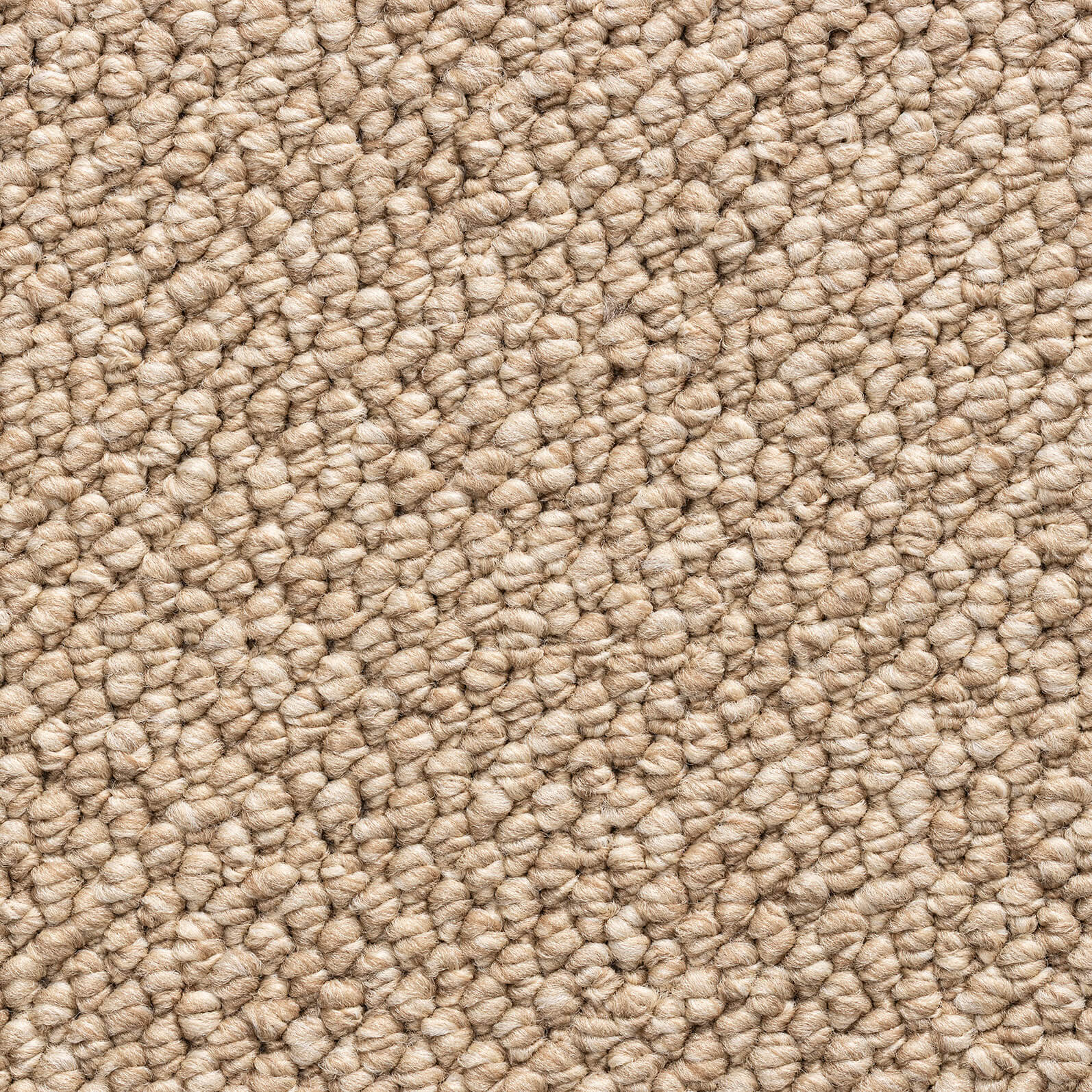 Close-up of beige looped carpet fibers forming a dense textured surface.