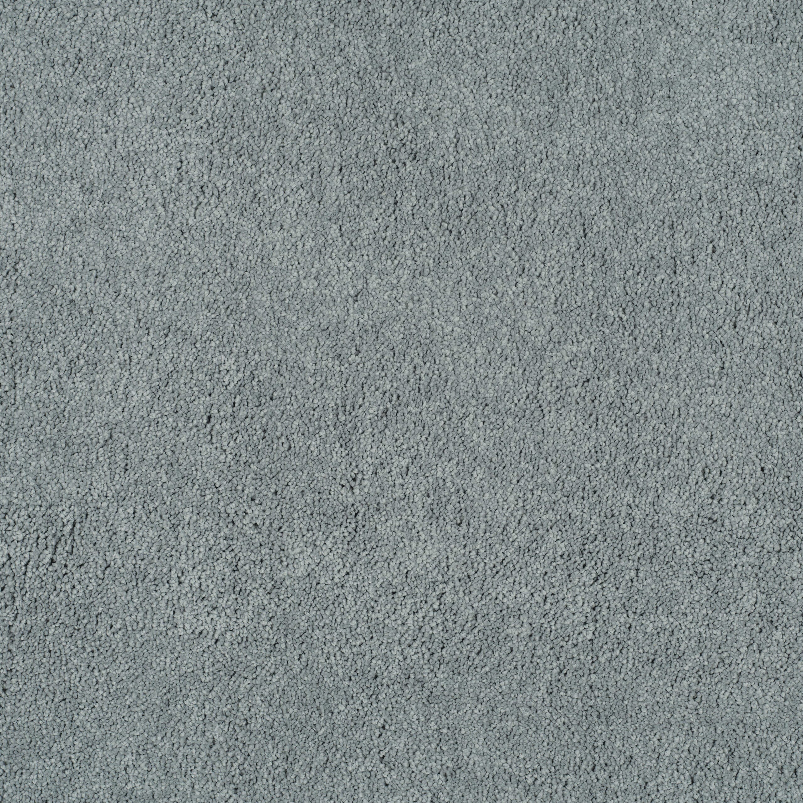 Close-up of a light gray textured carpet with dense, small loops.